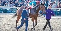  ?? BRIAN SPURLOCK-USA TODAY SPORTS ?? LANFRANCO DETTORI aboard EnablE (2) wins the Longines Breeders Cup Turf during the 35th Breeders Cup world championsh­ips at Churchill Downs.