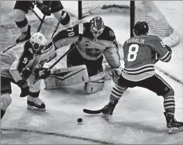  ?? CHRIS SWEDA/CHICAGO TRIBUNE ?? Blackhawks left wing Dominik Kubalik (8) tries to score against Blue Jackets goaltender Joonas Korpisalo in the second period Friday at the United Center in Chicago.