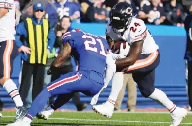  ?? JEFFREY T. BARNES/AP ?? Running back Jordan Howard breaks an attempted tackle by Bills safety Jordan Poyer on his 18-yard TD run.