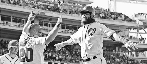  ?? BRAD MILLS, USA TODAY SPORTS ?? The Nationals’ Jayson Werth, being greeted after hitting a three-run homer Aug. 10 vs. the Indians, had a 46-game on-base streak.