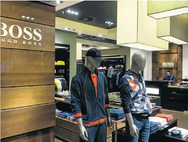  ?? Picture: WALDO SWIEGERS ?? RECESSION? WHAT RECESSION? The Surtee Group’s Hugo Boss store in Sandton City, Johannesbu­rg