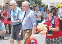  ??  ?? COMMON BOND: Roy Hartman, Clive Thomas from Wales and Wendy Erbacher at the Cenotaph.