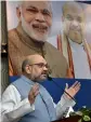  ?? — PTI ?? BJP president Amit Shah addresses during the conclave in New Delhi on Tuesday.