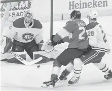  ??  ?? Montreal goalie Carey Price blocks a shot from Florida’s Nick Bjugstad, centre, as the Canadiens’ Jeff Petry defends.