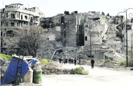  ?? Joseph Eid / AFP ?? The war-battered remnants of Aleppo city in March, which government forces recaptured last December.