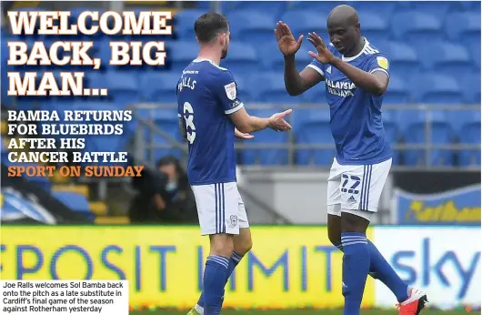  ??  ?? Joe Ralls welcomes Sol Bamba back onto the pitch as a late substitute in Cardiff’s final game of the season against Rotherham yesterday