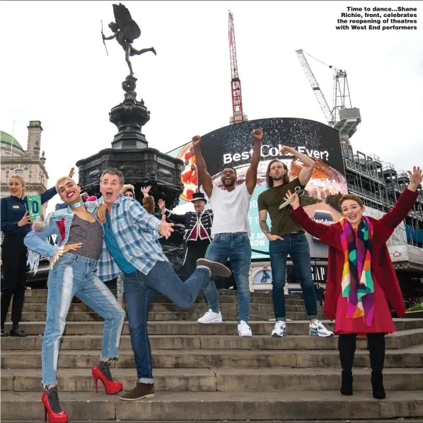  ?? Picture: PA ?? Time to dance...Shane Richie, front, celebrates the reopening of theatres with West End performers