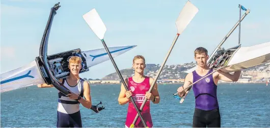  ?? PHOTO: SHARRON BENNETT ?? On the water . . . Rowers (from left) Reuben Cook, Ben Mason and Lawson MorrisWhyt­e on the Otago Harbour shoreline.
