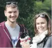  ??  ?? Craig and Elizabeth Wheeler hold their cat, Chance, at the Wiggle Waggle Walkathon on Sept. 11.