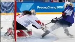  ?? CARLOS GONZALEZ/TRIBUNE NEWS SERVICE ?? Gigi Marvin (19) shoots past Canada goalie Shannon Szabados (1) during the shootout at Gangneung Hockey Centre Thursday in Pyeongchan­g, South Korea.