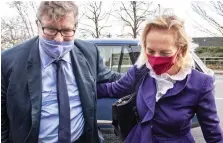  ??  ?? Trial: Crispin Odey with his wife Nichola yesterday