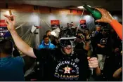  ?? ASSOCIATED PRESS ?? HOUSTON ASTROS STARTING PITCHER Gerrit Cole celebrates in the locker room after Game 6 of the American League Championsh­ip Series against the New York Yankees on Saturday in Houston.