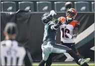  ?? CHRIS SZAGOLA - THE ASSOCIATED PRESS ?? Eagles defensive back Jalen Mills, left, breaks up a pass intended for Cincinnati Bengals receiver Auden Tate Sunday at Lincoln Financial Field.