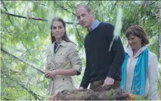  ?? JONATHAN HAYWARD/THE CANADIAN PRESS ?? The Duchess and Duke of Cambridge walk with Premier Christy Clark in the Great Bear Rainforest, now part of the Queen’s Commonweal­th Canopy, in Bella Bella on Monday.