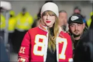  ?? ED ZURGA/AP FILE PHOTO ?? Taylor Swift wears a Kansas City Chiefs jacket as she arrives before an NFL wild-card playoff football game earlier this month in Kansas City, Mo. Pornograph­ic deepfake images generated by AI have hit its most famous victim, singer Taylor Swift.