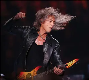  ?? RAY CHAVEZ — BAY AREA NEWS GROUP ?? SAN FRANCISCO, CALIFORNIA - SEPTEMBER 6: Metallica lead guitarist Kirk Hammett performs with the San Francisco Symphony in concert during the opening night of the new Chase Center in San Francisco, Calif., on Friday, Sept. 6, 2019. The Chase Center is the brand new home of the Golden State Warriors.