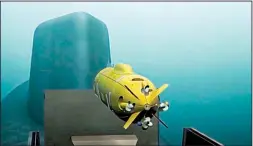  ?? AP/RU-RTR Russian Television ?? A Russian nuclear-powered underwater drone is shown being released from a submarine in a video aired Thursday on Russian television. Russian President Vladimir Putin said the vehicle could be armed with a nuclear warhead. At right, a laser weapon is...