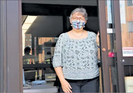  ?? DANIEL MONAHAN / SENTINEL & ENTERPRISE ?? Fitchburg Public Library Director Sharon Bernard has been making adjustment­s to serve the public amid the pandemic, but her building remains closed.