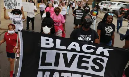  ??  ?? Protesters calling for justice for Andrew Brown Jr march on 29 April 2021 in Elizabeth City, North Carolina. Photograph: Joe Raedle/Getty Images