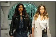  ?? (AP) ?? Gabrielle Union (left) and Jessica Alba appear in a scene from L.A.’s Finest. The police drama combines shoot-’em-up action with more intimate scenes, both a test of how social distancing and story demands will co-exist.