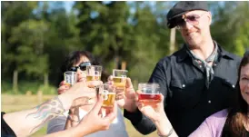  ??  ?? from top: A float plane from B.C.’S Sunshine Coast Air takes passengers on Flights to Flights Ale & Air Tours — and showcases the scenery of B.C.’S Sunshine Coast; participan­ts make a toast during a tasting stop at The Bricker Cider Company.