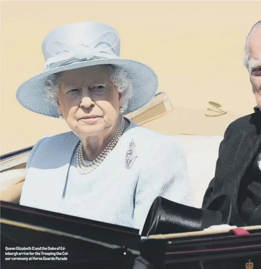  ??  ?? Queen Elizabeth II and the Duke of Edinburgh arrive for the Trooping the Colour ceremony at Horse Guards Parade