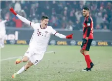  ?? — Reuters ?? Bayern Munich’s Robert Lewandowsk­i celebrates after he scored in extra time.