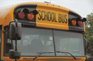  ?? StaffPhoto­ByangelaRo­wlingS ?? FLAWED? A school bus for Boston Public Schools travels on Brighton Avenue.