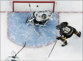  ?? THE ASSOCIATED PRESS ?? Vegas Golden Knights left wing James Neal (18) scores on San Jose Sharks goaltender Aaron Dell (30) during the third period of Game 1, Thursday in Las Vegas. The Golden Knights won 7-0.