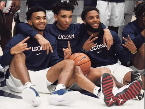  ?? Jessica Hill / Associated Press ?? From left, UConn’s Jalen Gaffney, James Bouknight and R.J. Cole pose for a photo during the 2019 First Night celebratio­n. Bouknight is the Huskies’ unquestion­ed top dog, and both Gaffney and Cole have the potential be the team’s No. 2 scorer.