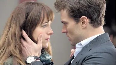  ??  ?? CREDIBLE CHEMISTRY: Dakota Johnson as Anastasia Steele and Jamie Dornan as Christian Grey