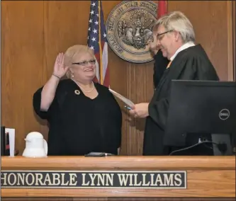  ?? The Sentinel-Record/Mara Kuhn ?? TAKING THE OATH: Division 3 Circuit Judge Lynn Williams, right, swears in Karen Garcia as a city director Wednesday. The Hot Springs Board of Directors appointed her to the vacant District 5 seat Tuesday night.