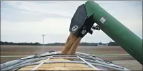  ?? GETTY IMAGES ?? Soybeans are loaded into a grain cart during harvest in Illinois, United States, on Sept 18.