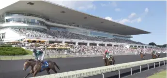  ??  ?? Horses and jockeys pass the grandstand at Arlington Internatio­nal Racecourse in Arlington Heights in 2017.