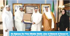  ??  ?? His Highness the Prime Minister Sheikh Jaber Al-Mubarak Al-Hamad AlSabah receives a report on Kuwait Expo 2018 from Minister of Commerce and Industry Khaled Al-Roudhan.