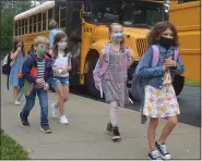  ?? PHOTO BY LAUREN HALLIGAN ?? Students arrive at Caroline Street Elementary School in Saratoga Springs on the first day of the 2021-2022 school year.
