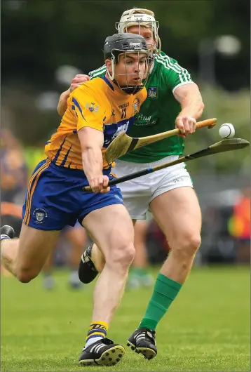  ??  ?? Tony Kelly of Clare in action against Cian Lynch of Limerick during the Munster hurling championsh­ip.