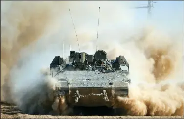  ?? (File Photo/AP/Tsafrir Abayov) ?? An Israeli armoured personnel carrier moves Thursday near the Gaza Strip border in southern Israel. Stories circulatin­g online incorrectl­y claim Israel’s Mossad intelligen­ce agency called the U.S. Air Force an “enemy” of Israel in a post on X.