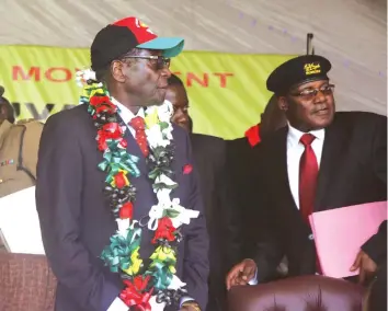  ??  ?? Flashback, President Mugabe exchange notes with the then Manicaland Provincial Governor, now Minister of Informatio­n, Media and Broadcasti­ng Services, Dr Chris Mushohwe during President Mugabe's 88th birthday celebratio­ns held in Mutare
