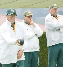  ??  ?? Raincoats were a must as cold and wet conditions hit the return of West Gippsland Bowls Division on Saturday.
Above: At Neerim District, division two bowler Angus McGillivra­y steps up to bowl as his teammates watch proceeding­s.