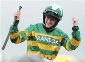  ??  ?? Jockey Rachael Blackmore on “Minella Times” celebrates winning the Grand National Hanidcap Chase. — AFP