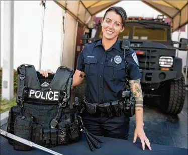  ?? MEGHAN MCCARTHY / THE PALM BEACH POST ?? West Palm Beach police officer Sarah Burgoon was chosen for the department’s SWAT team last week, surviving a process that has been described as “grueling” and “miserable.”