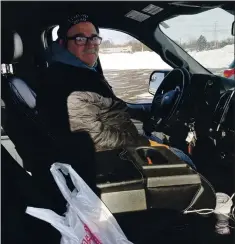  ?? MIKE HOUSEHOLDE­R — THE ASSOCIATED PRESS ?? Larry Parsons, who bought a used pickup last year in part due to the high cost of new trucks, sits inside his Ford F-150 in Livonia, Mich., on Tuesday.