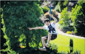  ?? MARK VAN MANEN/PNG ?? Antony Czeto got a thrill Wednesday as he tested the new zip line in Queen Elizabeth Park.