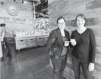  ?? MATHEW MCCARTHY WATERLOO REGION RECORD ?? Sara McMurphy, left, and Jennifer Appleby Vines, owners of the Crumby Cookie Dough Company, hold some of their product at the Graffiti Market, one of their retail outlets.