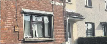  ??  ?? A broken window at a house in Ballymena after reports of a disturbanc­e in the area on Saturday evening