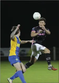  ??  ?? Wexford Youths’ Lee Chin competes with Bray’s Andrew Lewis.