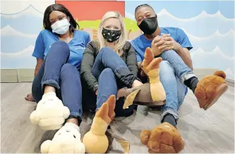  ?? | SHELLEY KJONSTAD ?? SLIPPER Day is Reach For A Dream’s most celebrated fund-raiser, and this year’s Slipper Day is set to take place on Friday, May 7. Nomvelo Zungu, Kerry Donkin and Bulelwa Zulu show off their fluffy slippers. African News Agency (ANA)