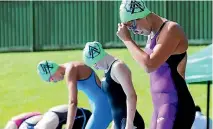  ?? PHOTO: WARWICK SMITH/FAIRFAX NZ ?? Ashhurst Aquanauts swimmers Paris Cutler, left, Piper Humphreys and Paige Cutler on the starting blocks during the Manawatu open championsh­ips at the Lido at the weekend.