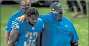  ?? GETTY IMAGES FILE ?? Detroit’s D’andre Swift, left, is comforted by head coach Matt Patricia while walking off the field after the Lions blew a 17-point lead in the fourth quarter in their opener.